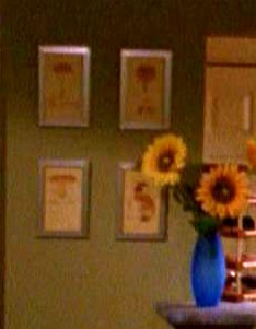 View towards the kitchen from the living room, showing the bar stools.