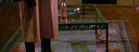 coffee table on blue rug.