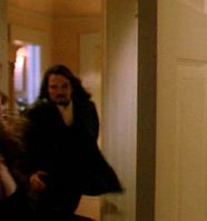 looking back to the lobby from the bedroom door, with the doors to the living room and kitchen in the background