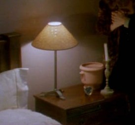 the bedside table on the right side of the bed