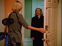 at the door to Tracy's apartment