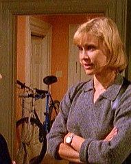 at the door to Tracy's apartment