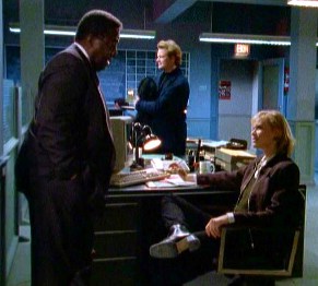 Nick and Tracy listen to Captain Reese's story about Betty Ann MacKenzie