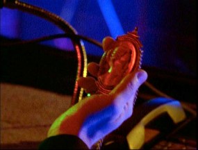 LaCroix looks at Divia's cameo as he makes his broadcast