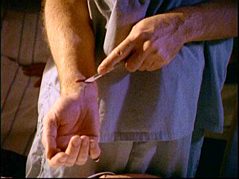 LaCroix cuts his own wrist